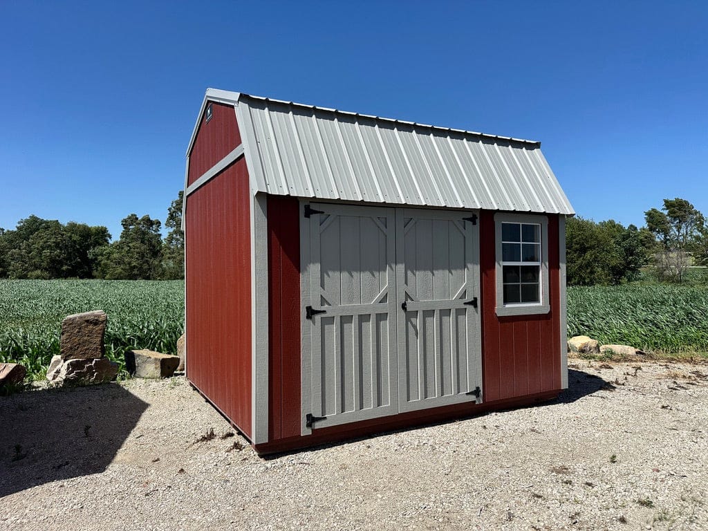 Exterior of red and grey lofted shed