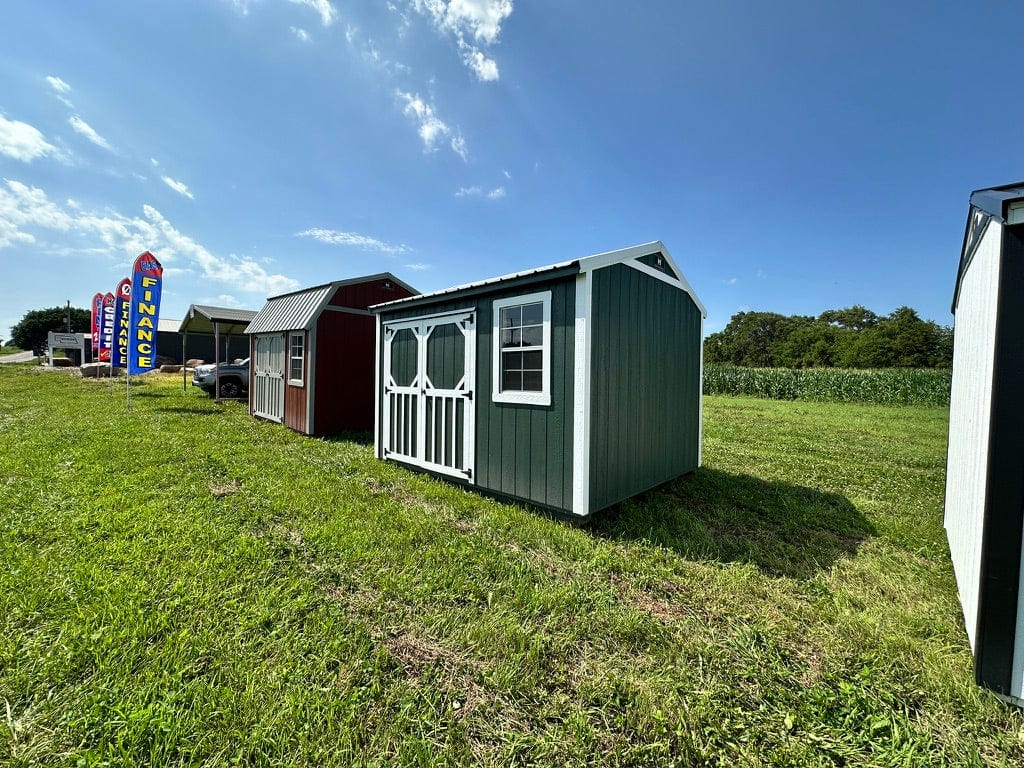 Exterior of small garden shed, highlighting doors.