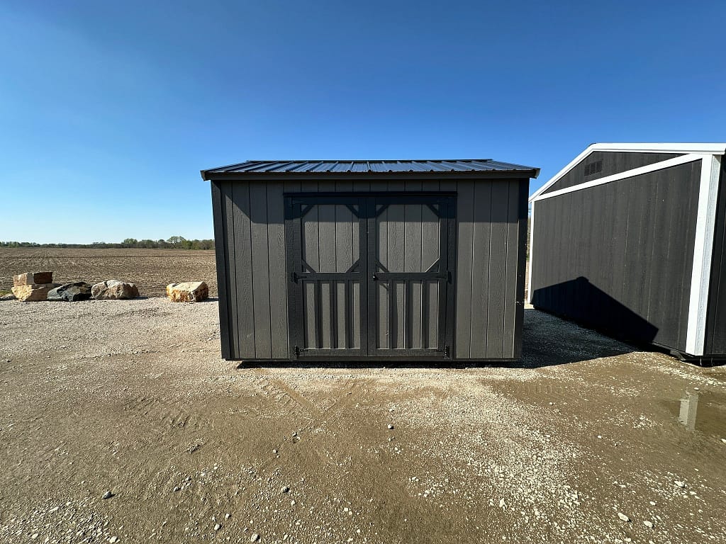 Exterior of small garden shed with double doors on the front.