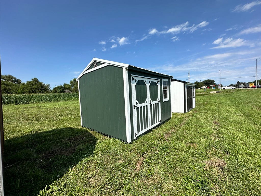 Exterior of small garden shed, highlighting doors.