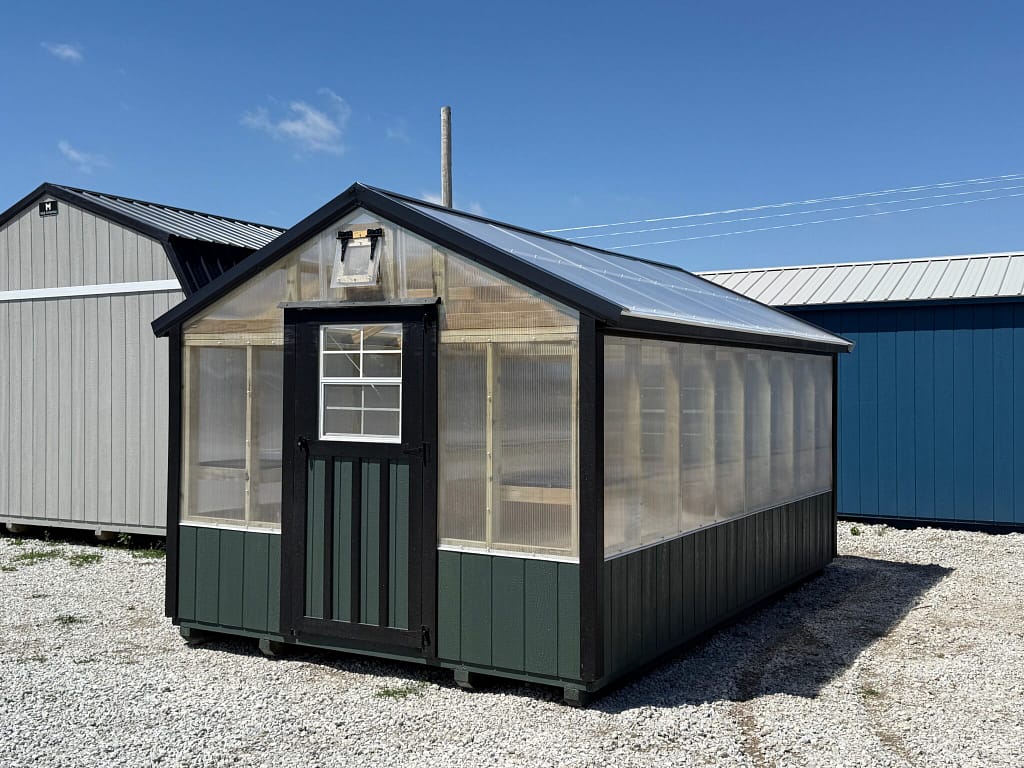 Exterior of long greenhouse, showcasing the standard size door on the front