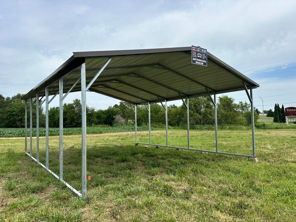 Exterior showing large carport in the grass.