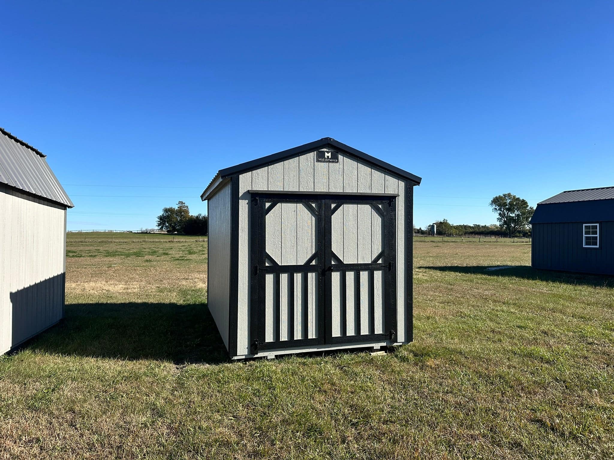 Exterior of small shed showcasing the main doors.