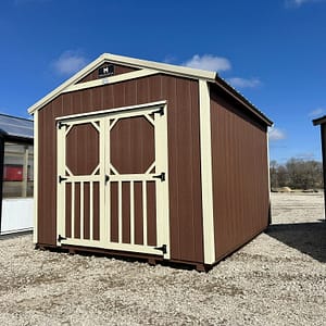 Exterior of small shed with double doors.