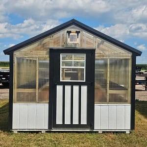 Exterior of a greenhouse, showcasing the front.