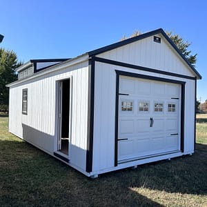 Exterior of white garage with single car garage door.