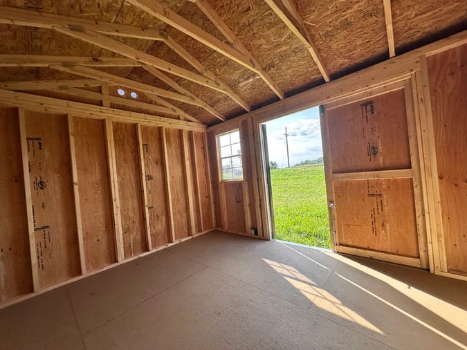 Interior of shed; looking towards front corner by window and door