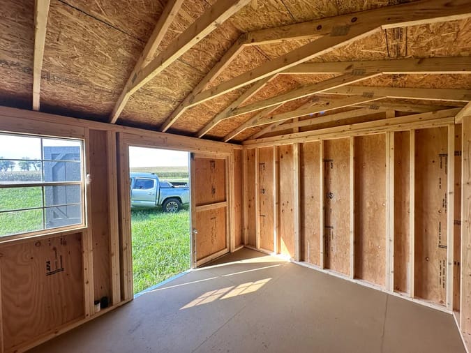Interior of shed; looking to front corner of door and window