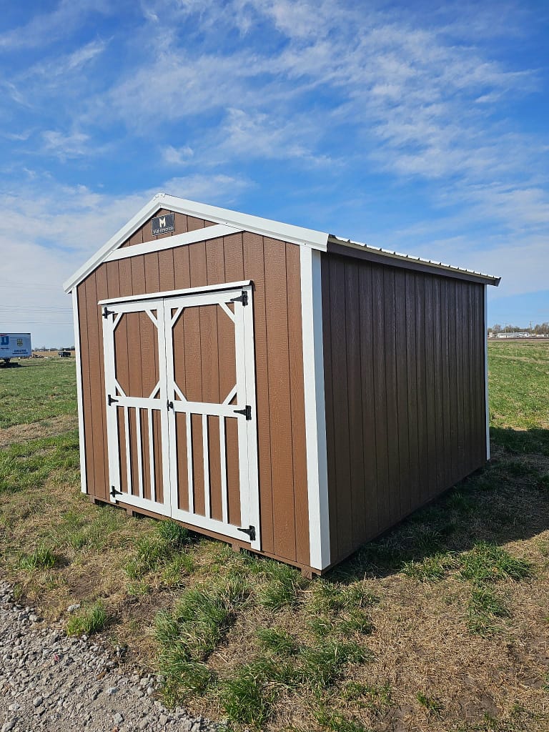 Exterior of small, double door utility shed with white trim