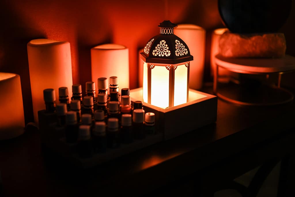 Small lantern and candles on a shelf in Eva's therapy office.